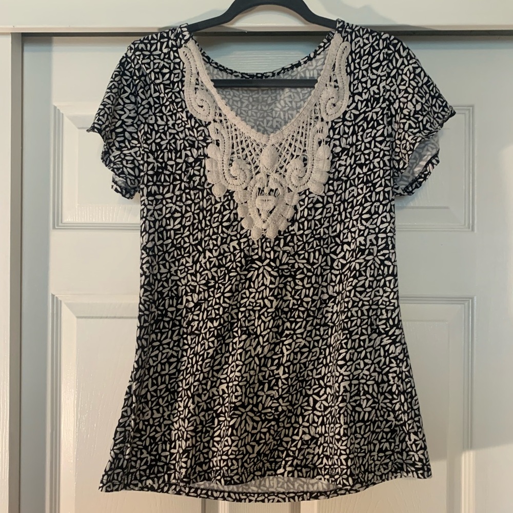 Black and white shirt with floral neck